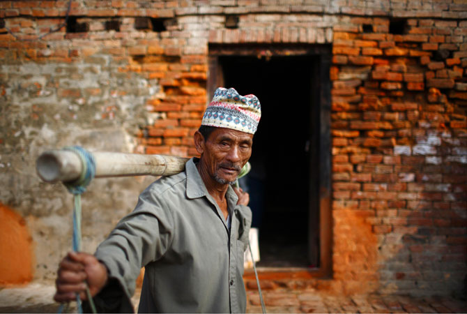 A farmer heads home after selling vegetables along the streets of the ancient Nepalese city of Bhaktapur.