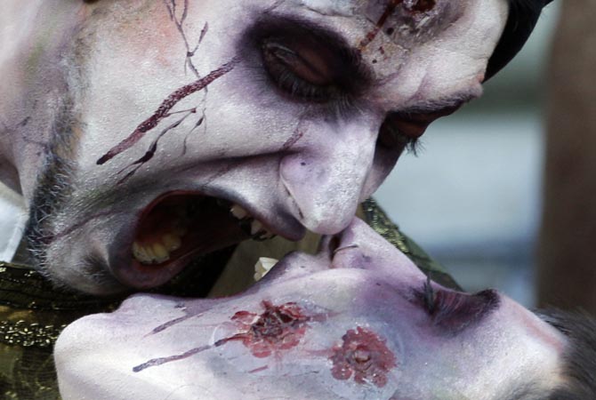A couple pose together, dressed as zombies attend the Zombie Walk in Belgrade, Serbia, on Saturday. ?AP Photo