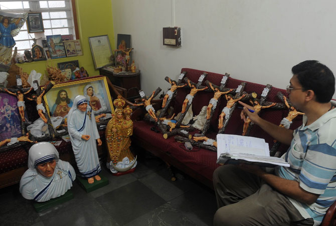 Word-of-mouth has helped their commissions to increase both at home and abroad. In their house sit two dozen crucifixes, with flashing red bulbs depicting dripping blood, which are destined for the Middle East.