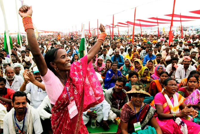 A landless rural India woman cheers after P.V. Rajagopal, the leader of thousands of farmers. ? Photo by AP