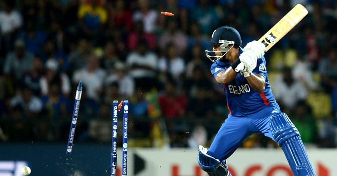 Samit Patel watches as his bails goes in air after being clean bowled by Lasith Malinga ? Photo by AFP