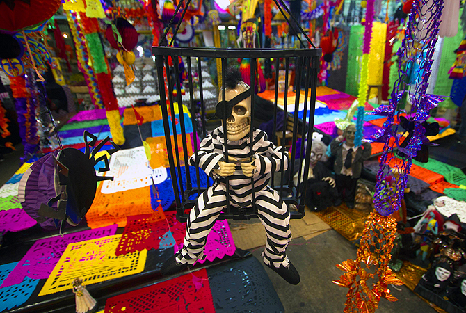 A skeleton figure is displayed at the Jamaica market in Mexico City to celebrate the Day of the Dead. The rituals that celebrate deaths of ancestors for this holiday date back to almost 2500 years.
