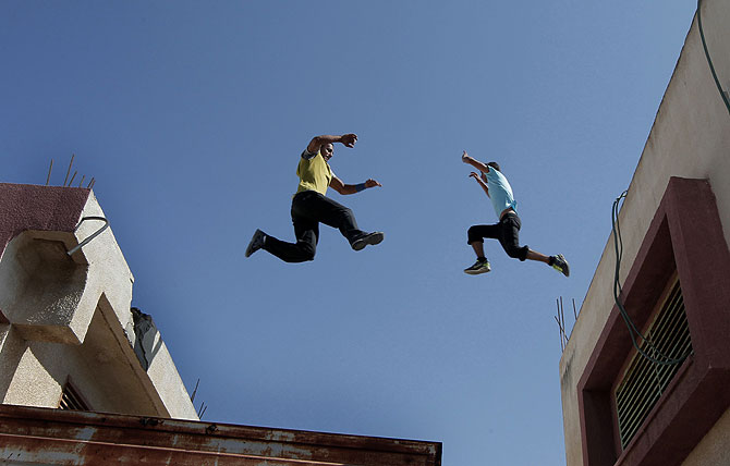 Palestinian youths practicing their parkour skills, also known as free running in the town of Khan Younis, in the southern Gaza Strip.