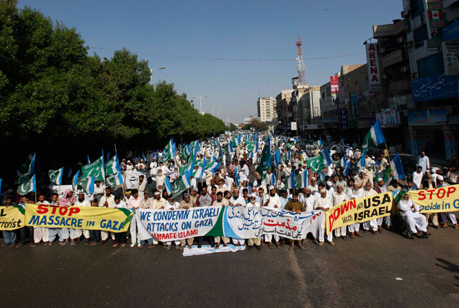 Supporters of the political and religious party Jamat-e-Islami take part in an anti-US and anti-Israel rally in Karachi November 23, 2012. Israeli gunfire at the Gaza border killed one Palestinian on Friday and wounded several others, medics said, two days after a ceasefire between the territory's rulers Hamas and Israel took hold.