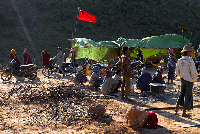 Hundreds of Buddhist monks and villagers occupying the mine, they said is causing environmental, social and health problems, defied a government order to leave by Wednesday, saying they will stay until the project is halted.?Photo by AP