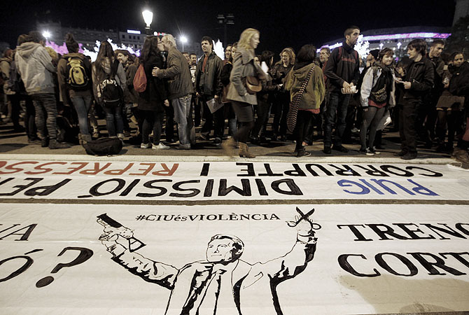 According to these protesters in Barcelona, they are demonstrating in solidarity with 42-year-old Esther, who was blinded in one eye due to a rubber ball, which are fired from anti-riot guns, on the day of the general strike on November 14.?Photo by Reuters