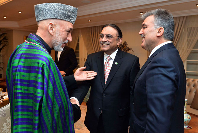 Presidents Hamid Karzai of Afghanistan (L), Asif Ali Zardari of Pakistan (C) and Abdullah Gul of Turkey (R) chat during a dinner at the Presidential Palace of Cankaya in Ankara late December 11, 2012.