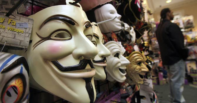 In this Oct 21, 2011 file photo, masks, including “V for Vendetta,” left, are displayed at a Ricky's Halloween store in New York. - AP Photo