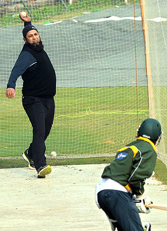 Inzamam-ul-Haq bowls to batsman in the nets. ? Photo by AFP