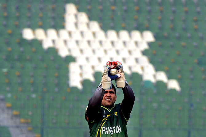 Pakistan's wicketkeeper Kamran Akmal catches a ball during practice. ? Photo by AFP