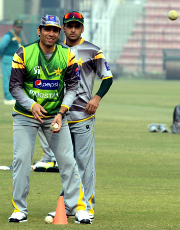 Pakistan's ODI and T20 captains Misbah-ul-Haq and Mohammad Hafeez take part in fielding practice. ? Photo by AFP