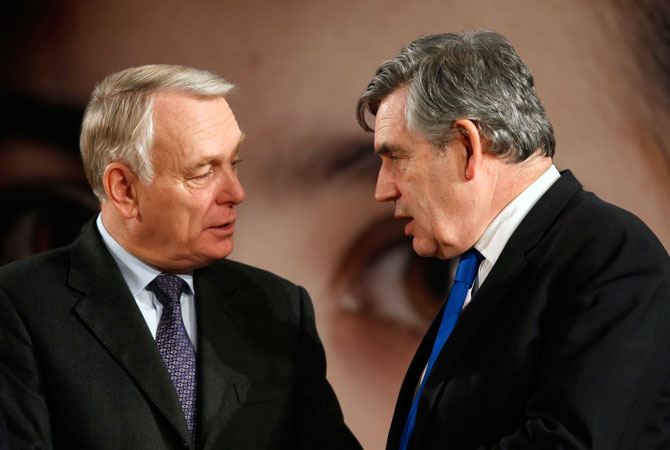 French Prime Minister Jean-Marc Ayrault (L) speaks with Gordon Brown, former British Prime Minister and UN Special Envoy for Global Education, during the event ?Stand up for Malala, Girls' education is a right!? during the United Nations Human Rights Day at the Unesco headquarters in Paris December 10, 2012. A special tribute was paid to Malala Yousafazi, the teenage Pakistani schoolgirl shot by the Taliban after advocating education for girls, at the British hospital where she is being treated.