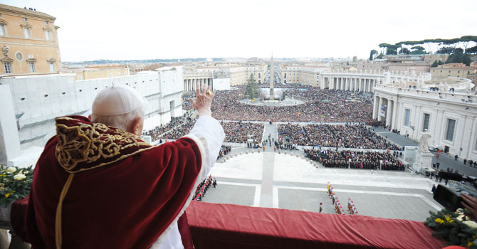 In this photo provided by Vatican paper L'Osservatore Romano, Pope Benedict XVI delivers his “Urbi et Orbi” (to the City and to the World) message from the central balcony of St. Peter's Basilica, at the Vatican, Tuesday, Dec. 25, 2012. Pope Benedict XVI wished Christmas peace to the world, decrying the slaughter of the “defenseless” in Syria and urging Israelis and Palestinians to find the courage to negotiate. Delivering the Vatican's traditional Christmas day message from the central balcony of St. Peter's Basilica, a weary-looking and hoarse-sounding Benedict on Tuesday also encouraged Arab spring nations, especially Egypt, to build just and respectful societies. - Photo by AP