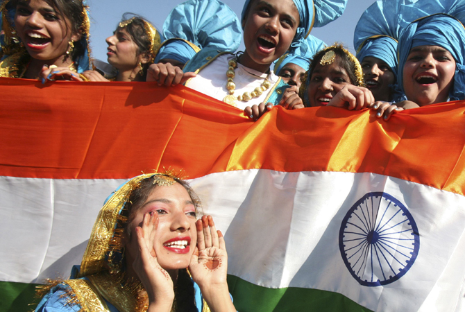 School children cheer after performing at a cultural program during the Republic Day celebrations in the northern Indian city of Chandigarh January 26, 2013.