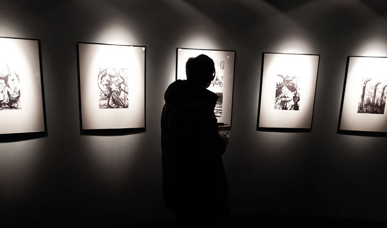 A visitor passes through a newly-opened Russian exhibition at the Auschwitz concentration camp. ?Photo by Reuters