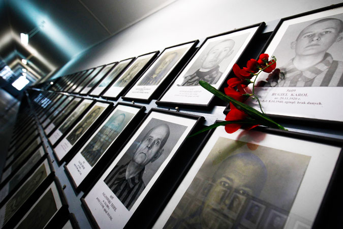 Pictures of former prisoners hang on a wall at one of the barracks at the Auschwitz concentration camp. ?Photo by Reuters