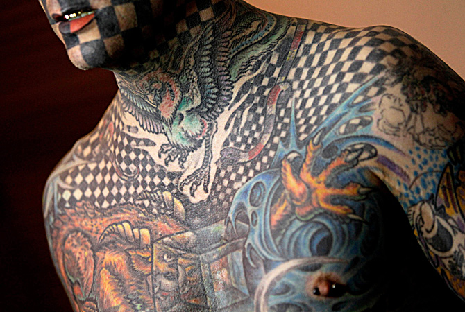 Matt Gone who is known as The Checkered Man poses for a photo at the 3rd annual Venezuela Tattoo International Expo in Caracas, Venezuela. As many as 300 tattoo artists from a variety of countries are expected to attend the 4-day event, sharing their skills including under the skin implants and body piercings. ? AP Photo