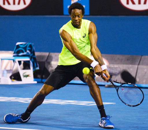 France's Gael Monfils hits a return against Ukraine's Alexandr Dolgopolov Jr. during their men's singles first round match.