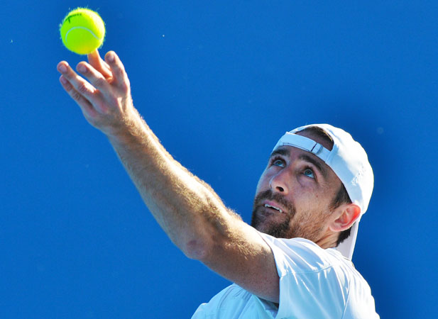 Germany's Benjamin Becker serves against Sloveina's Aljaz Bedene during their men's singles first round match.