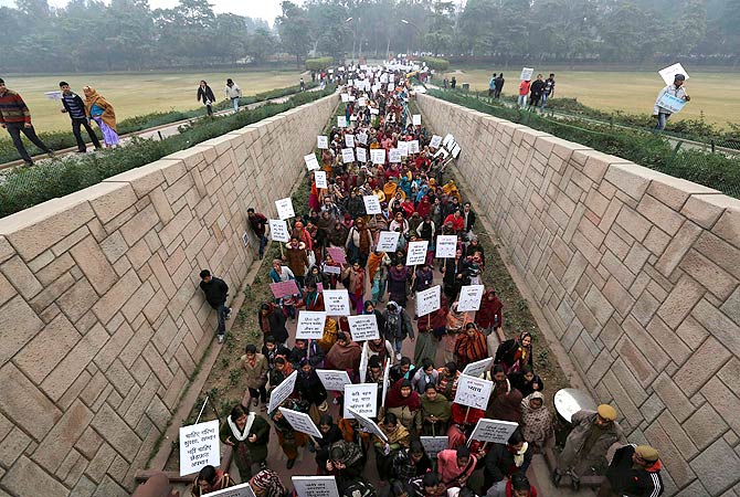 Women carrying placards enter Raj Ghat to attend a prayer ceremony for a rape victim after a rally organized by Delhi Chief Minister Sheila Dikshit (unseen) protesting for justice and security for women, in New Delhi January 2, 2013. ? Reuters Photo