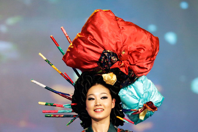A model displays a hairdo by Seokyeong University Beauty Design students on the runway during the Asia Beauty Festival in Seoul, South Korea. ?Photo by AP