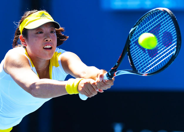 Japan's Ayumi Morita hits a return against Georgia's Anna Tatishvili during their women's singles first round match.