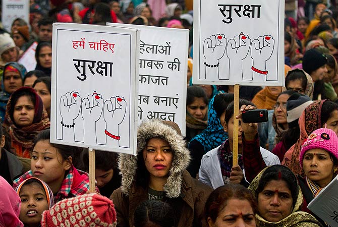 Indian women carry signs as they march to mourn the death of a gang rape victim in New Delhi, India, Wednesday, January 2, 2013. India's top court said it will decide whether to suspend lawmakers facing sexual assault charges as thousands of women gathered at the memorial to independence leader Mohandas K. Gandhi to demand stronger protection for their safety. The banners read "We need safety." ? AFP Photo