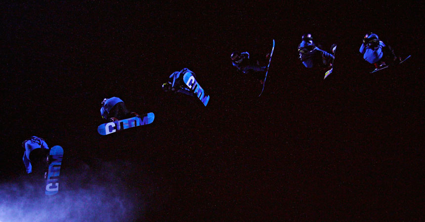 Snowboarders fly in the air during the men's Snowboard Big Air finals at the FIS Snowboard World Championships. ?Photo by Reuters