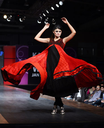 A Pakistani model presents a piece from Vasim Asghar's Moulin Rouge-inspired collection. ?Photo by AFP
