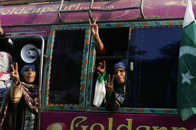 Supporters react in a bus during a protest march from Lahore to Islamabad January 13, 2013. ? Photo by Reuters
