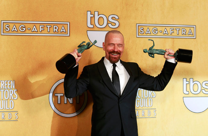 Actor Bryan Cranston poses backstage with his awards for ?Outstanding Male Actor in a Drama Series? for ?Breaking Bad? and for ?Outstanding Ensemble Cast in a Motion Picture? for ?Argo?. ?Photo by Reuters