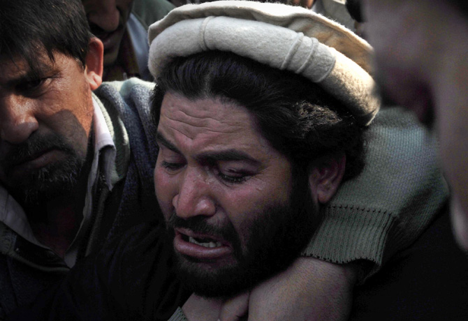 A villager from the northwest mourns the death of a relative during a protest in the provincial capital Peshawar on January 16, 2013. – Photo by AFP