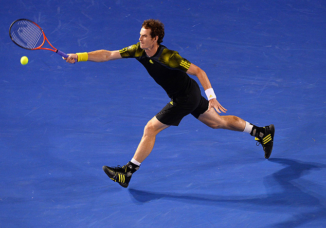 Britain's Andy Murray hits a return against Serbia's Novak Djokovic during the men's singles final on day 14 of the Australian Open tennis tournament in Melbourne on January 27, 2013. – Photo by AFP