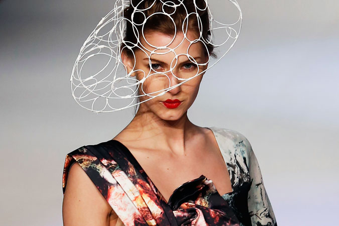 A model presents a creation by Aries Sin Mei-yuk's collection during Hong Kong Young Fashion Designers' contest at the Hong Kong Fashion Week for Fall/Winter 2013 in Hong Kong. More than 1,800 exhibitors from 30 countries and regions are taking part in the 44th Hong Kong Fashion Week. ?Photo by Reuters