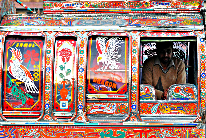A commuter travels in a decorated minivan in Rawalpindi. — AFP Photo