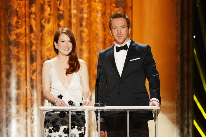 Actors Julianne Moore and Damian Lewis speak onstage. ?Photo by AFP