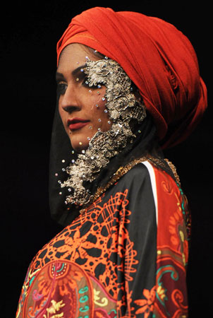 A Pakistani model presents a creation by Malaysian designer Sharifah Kirana. ?Photo by AFP