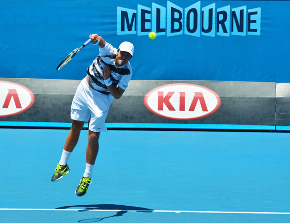 Steve Johnson of the US serves against Spain's Nicolas Almagro during their men's singles first round match.