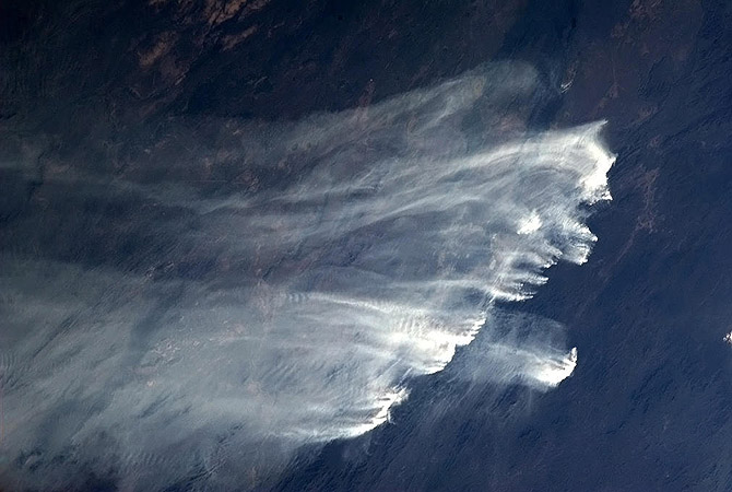 Bushfires in Australia are pictured in this January 2, 2013 handout photo taken by Canadian astronaut Chris Hadfield aboard the International Space Station.?Photo by Reuters