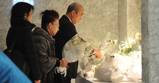People offer flowers and condolences for Japanese victims who have been confirmed dead, at the Japanese plant construction company JGC headquarters in Yokohama, suburban Tokyo on Jan 24, 2013 following the Algerian hostage crisis in In Amenas when militants struck on Jan 16 at the start of a four-day siege that left dozens of foreigners dead. - AFP Photo