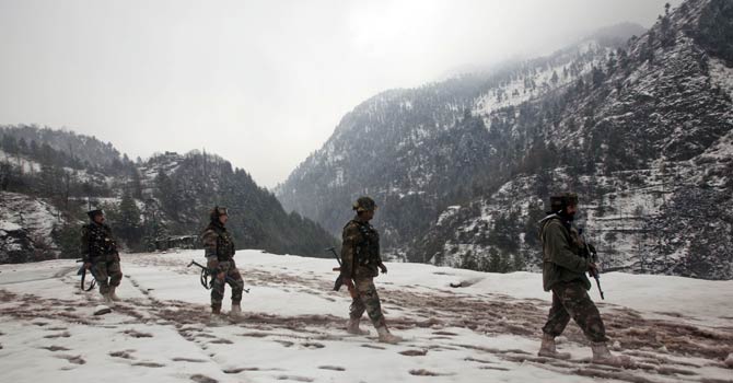 Indian army soldiers patrol near the Line of Control (LOC), the line that divides Kashmir between India and Pakistan, in Silikot some 130 Kilometres north of Srinagar, India, Thursday, Jan 17, 2013. - File Photo