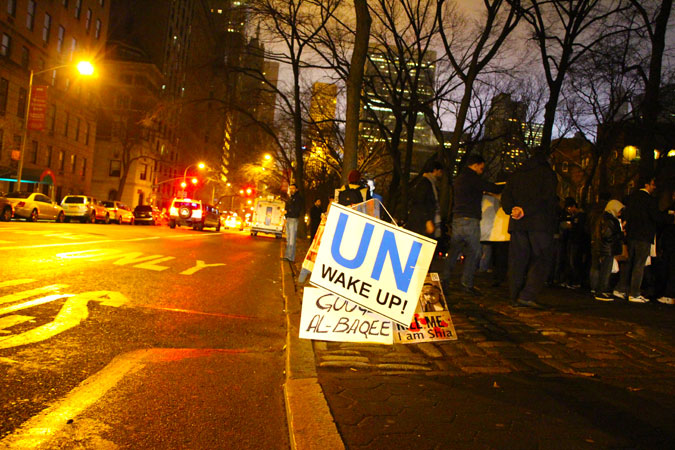 Picture shows a protest placard that demands effort from the UN to act against the bombings. The protest took place in New York City. - Photo by Sadef Ali Kully/Dawn.com