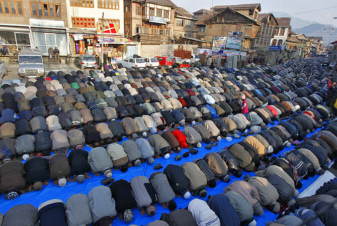 Kashmiri Muslim men offer prayers outside the shrine of Sufi Saint Khawaja Naqashband on his death anniversary in Srinagar. Thousands of Kashmiri Muslims, who believe in Sufism, thronged the shrine of the saint on his 349th death anniversary and offered special prayers on Wednesday.?Photo by Reuters