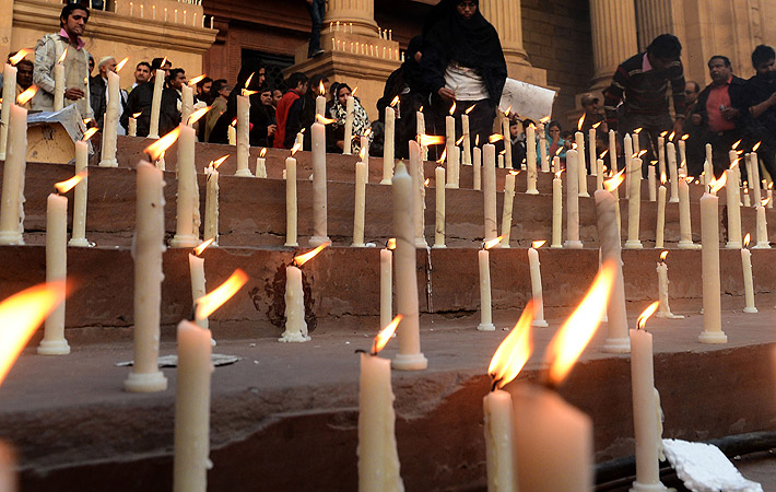 Pakistani students, civil society and Pakistan Muslim League Nawaz party activists light candles in the favor of democracy in Lahore. Pakistan's main opposition leader Nawaz Sharif demanded that the government immediately announce a timetable for elections.?Photo by AFP