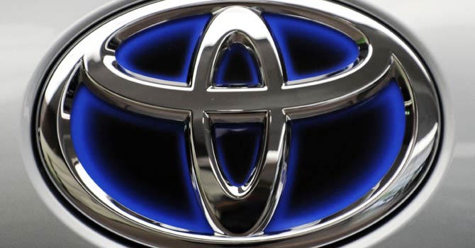 This file photo taken on Aug 2, 2011, shows a Toyota Motors logo displayed at their Tokyo headquarters. Toyota and Nissan on Jan 28, 2013 posted record sales for 2012 as the Japanese car giants benefited from a pick-up in demand, with Toyota recapturing the world's biggest automaker crown from General Motors. - AFP Photo