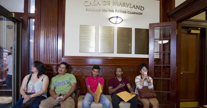 This Aug 15, 2012 file photo shows applicants waiting in Casa de Maryland in Langley Park, Md., before they can apply for the Deferred Action Childhood Arrivals, as the US started accepting applications to allow them to avoid deportation and get a work permit -- but not a path to citizenship. - AP Photo