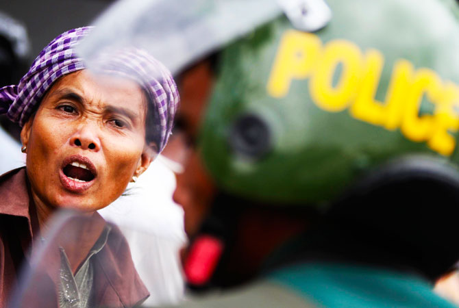 Woman reacts during a protest in front of the Peace Palace in Phnom Penh. Boeung Kak lake residents, embroiled in land disputes in the capital, gathered to appeal to Cambodian Prime Minister Hun Sen for help regarding the threatened eviction from their land to be used for the development of luxury private property. -Photo by Reuters