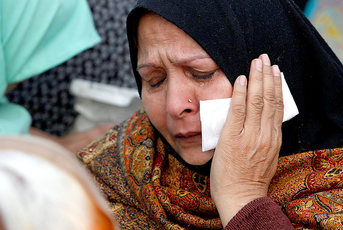 A Shia Muslim woman cries during a protest against Saturday's bombing, in Lahore February 18, 2013. ? Reuters Photo