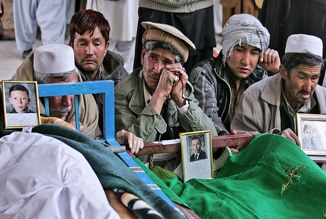 Pakistani relatives of Saturday's bombing victims mourn next to their bodies in a mosque in Quetta, Pakistan, Sunday, Feb. 17, 2013. Angry residents on Sunday demanded government protection from an onslaught of attacks against Shiite Muslims, a day after scores of people were killed in a massive bombing that a local official said was a sign that security agencies were too scared to do their jobs. ? AP Photo