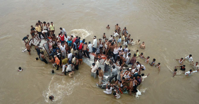 The bus crashed onto the Matamuhuri's parched river bed after the driver lost control of the vehicle which then smashed through railings on a bridge. -AFP (File Photo)